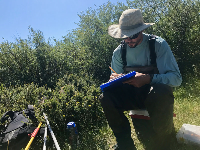 Brian Maitland working in the field