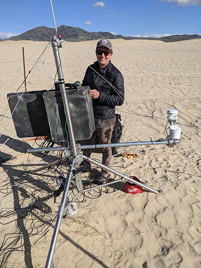 Bridger Huhn working with monitoring equipment.